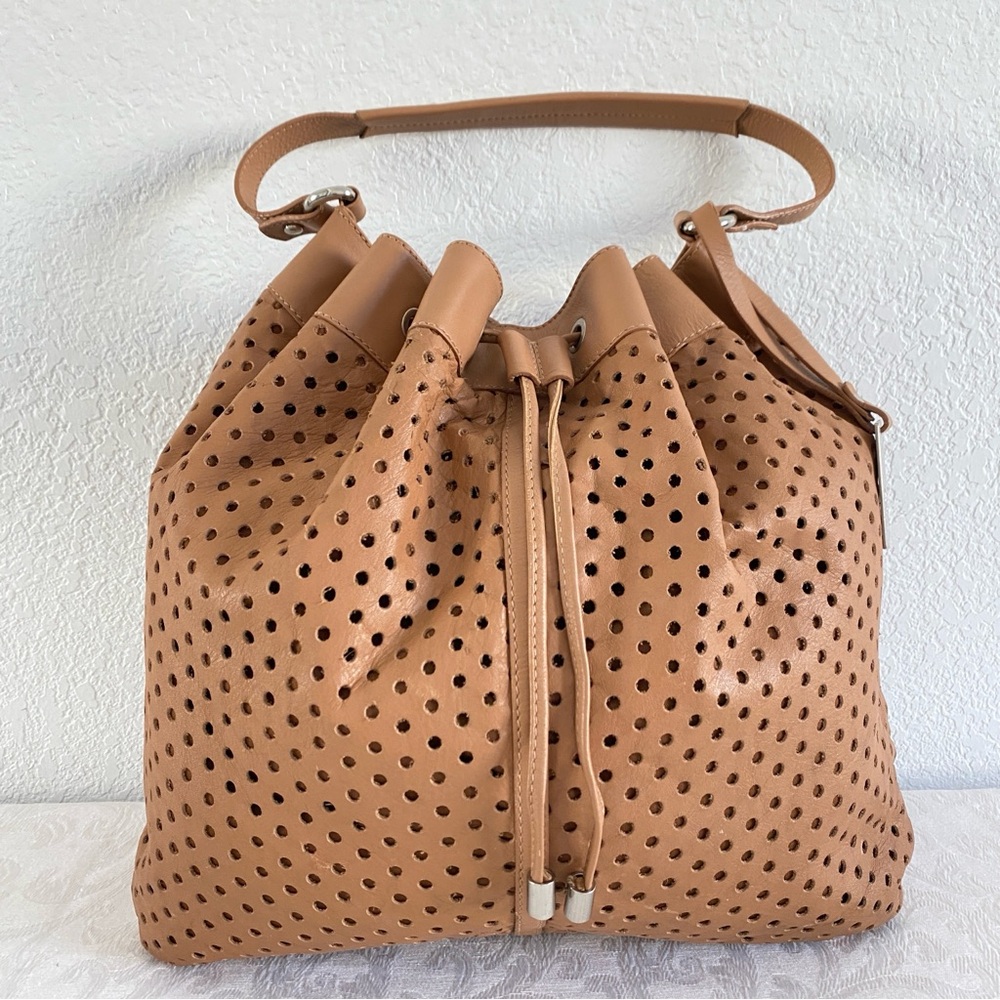 Puntotres brown perforated drawstring leather bucket bag